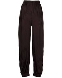 The Attico - Logo-jacquard Tapered Trousers - Lyst