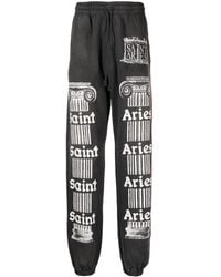 SAINT Mxxxxxx - Slogan-Print Cotton Track Pants - Lyst