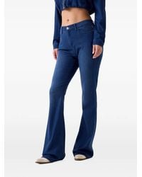 Guess - Logo-Patch Flared Jeans - Lyst