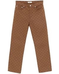 Sandro - Monogram-Pattern Jeans - Lyst