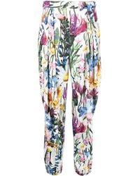 Stella McCartney - Pantalones ajustados con motivo floral - Lyst