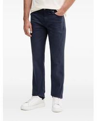 Guess - Logo-Plaque Jeans - Lyst