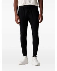 Asics - Pantalones De Chándal Road Con Logo Estampado - Lyst