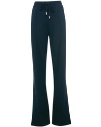 JW Anderson - Slim-Cut Flared Track Pants - Lyst