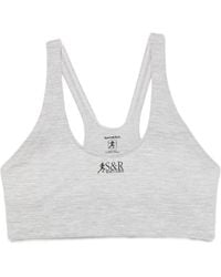 Sporty & Rich - Logo-Print Racerback Sports Bra - Lyst