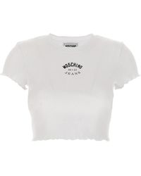Moschino - T-Shirt mit Logo-Stickerei - Lyst