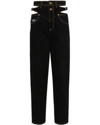 Versace - Gerade Jeans mit Logo-Gravur - Lyst