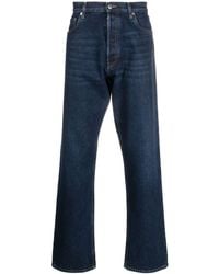 Prada - Gerade Jeans mit Logo-Schild - Lyst