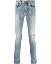 Saint Laurent - Jeans skinny con effetto vissuto - Lyst