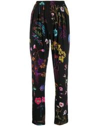 Stella McCartney - Floral Print Tapered Trousers - Lyst