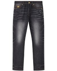 Versace - Faded Jeans With Medusa Detail - Lyst