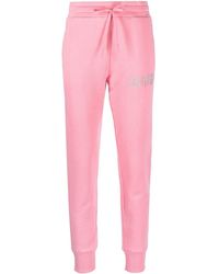 Sweatpants with logo Jean Versace Jeans Couture en coloris Rose Femme Vêtements Articles de sport et dentraînement Pantalons de survêtement/sport 