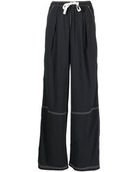Izzue - Pantaloni a gamba ampia con coulisse - Lyst