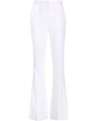 Genny - Iconic High-waist Flared Trousers - Lyst