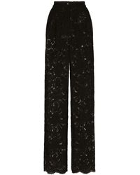 Dolce & Gabbana - Pantalon flare en dentelle stretch à logo - Lyst