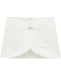 Courreges - Denim Miniskirt With Ellipse Buckle - Lyst