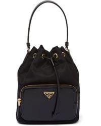 Prada - Duet Re-Nylon Brand-Plaque Recycled-Polyamide Bucket Bag - Lyst