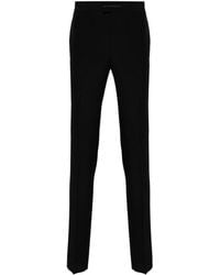 Givenchy - Pantalones rectos con placa del logo - Lyst