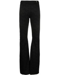 Versace - Pantalones Acampanados De Punto Greca - Lyst