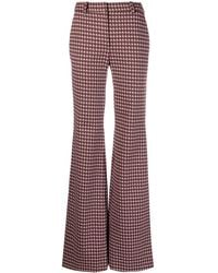 Moschino - Graphic-Print Flared Trousers - Lyst