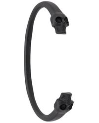 Alexander McQueen Brazalete con detalles de calaveras - Negro