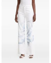 Guess - Floral-Print Logo-Patch Jeans - Lyst