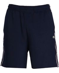 Lacoste - Pantalones cortos de deporte con detalle de rayas - Lyst