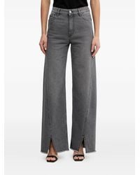 SIMONA CORSELLINI - Frayed Split Jeans - Lyst