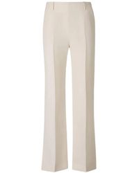 KHAITE - Pressed-Crease Slit-Hem Trousers - Lyst
