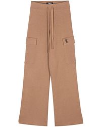 Amiri - Logo-Embroidered Ribbed Trousers - Lyst