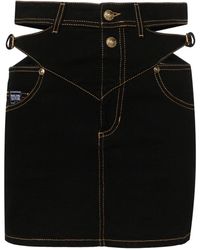 Versace - Jeans-Minirock mit barocker Schnalle - Lyst