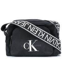 Calvin Klein Bandolera con logo estampado - Negro