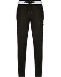 Dolce & Gabbana - Pantalones de chándal con franjas del logo - Lyst