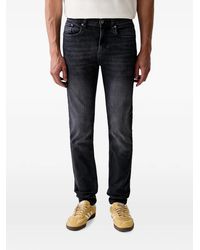 KARL LAGERFELD - Logo-Print Whiskered Slim-Fit Jeans - Lyst