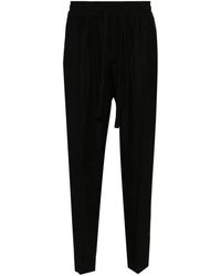 Dolce & Gabbana - Pantalones con logo en jacquard - Lyst