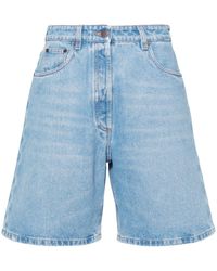 Prada - Short en jean à logo émaillé - Lyst