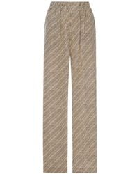 Balenciaga - All-Over Logo-Print Silk Trousers - Lyst