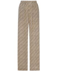 Balenciaga - All-Over Logo-Print Silk Trousers - Lyst