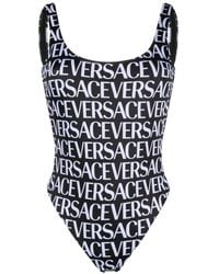 Versace - And White All-over Logo Print Swimsuit - Lyst
