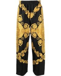 Versace - Pantalon en soie à imprimé Barocco - Lyst