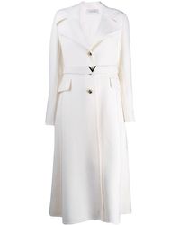 Valentino Abrigo midi con cinturón y aplique de V - Blanco
