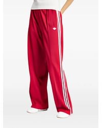 adidas - Firebird Ruimvallende Trainingsbroek - Lyst