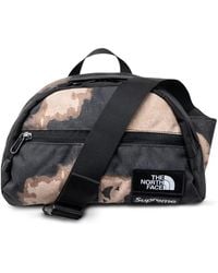 Supreme - X The North Face Roo Ii Bleached Denim-Print Bag - Lyst