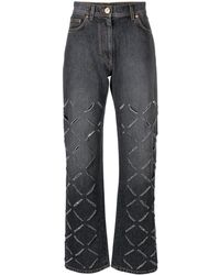 Versace - Jeans grigi strappati a gamba dritta - Lyst