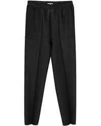 Issey Miyake - Plissé Tapered Trousers - Lyst