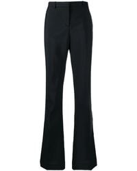 Versace - Flared Low-Rise Trousers - Lyst
