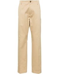Versace - Pantalones chinos de talle medio - Lyst
