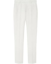 Versace - Logo-Patch Trousers - Lyst