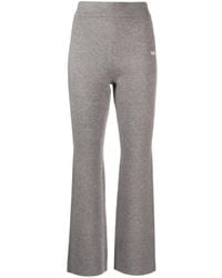 Izzue - Logo-embroidered Flared Trousers - Lyst