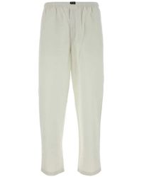 Prada - Elasticated-Waist Logo-Patch Trousers - Lyst